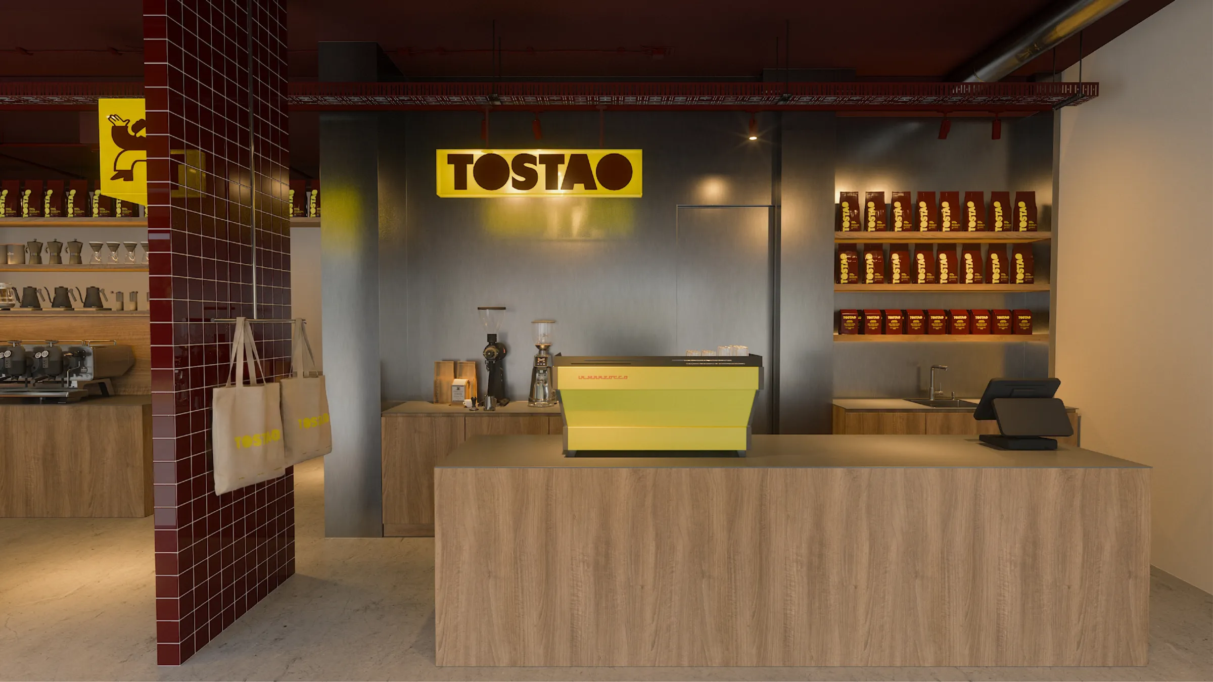 Mostrador de madera con la máquina de café amarilla y el rótulo Tostao